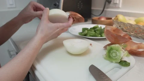 Breaking Down and Dicing a Yellow Onion Stock Footage 106329090