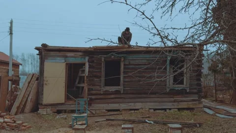 Breaking down a house by assembly Stock Footage 321878388