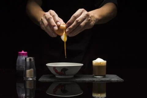 Breaking an egg for breakfast Stock Photos