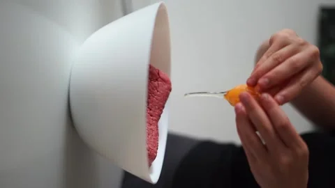 Breaking an egg. throw in mincemeat Stock Footage 244859073