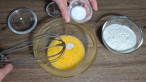 Breaking eggs and mix them Stock Footage 164155771
