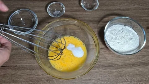Breaking eggs and mix them Stock Footage 164155801