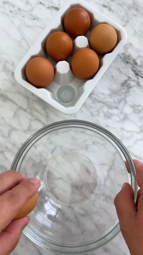 Breaking eggs Stock Footage 336188009
