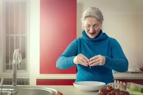 Breaking eggs Stock Photos