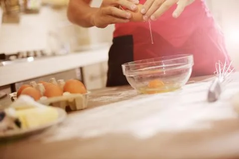 Breaking eggs Stock Photos