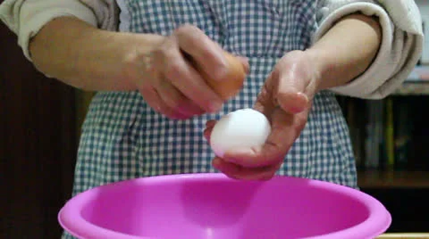 Breaking Eggs Slow Motion Stock-Footage 22822775