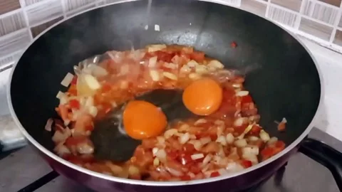 Breaking eggs slow motion Stock Footage 83875525