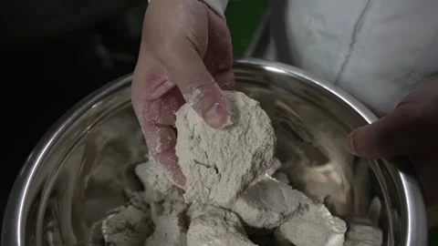 Breaking Up Fermented Starch Blocks for Kuzumochi in a Bowl Stock Footage 340009392