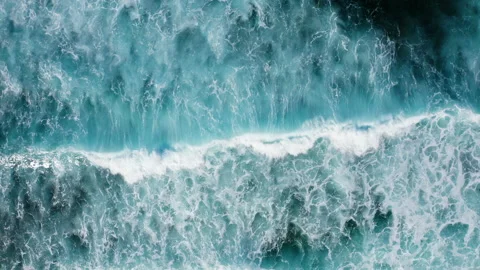 Breaking foaming ocean waves top down aerial view Stock Footage 169848593