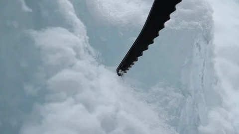 Breaking ice with ice pick in Alberta 動画素材 90875772