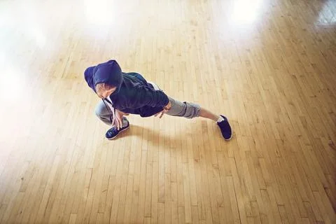 Breaking it down. High angle shot of a young man breakdancing in a studio. Stock Photos
