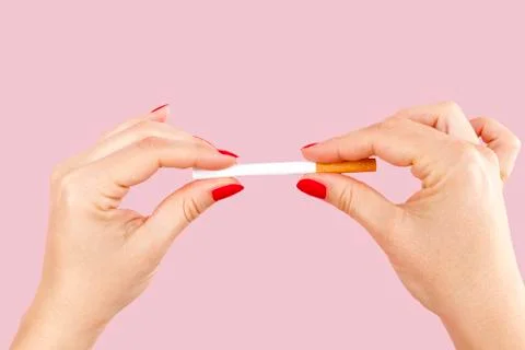 Breaking the last cigarette. Stock Photos
