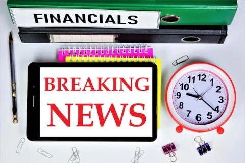 Breaking news-a text message on the screen of the tablet computer monitor. Stock Photos