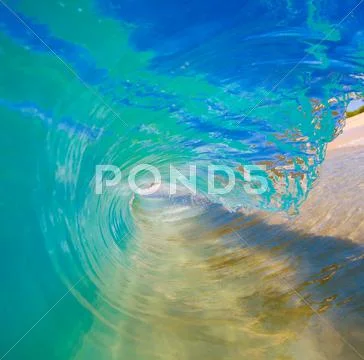 Breaking ocean wave crashing over camera Stock Photos