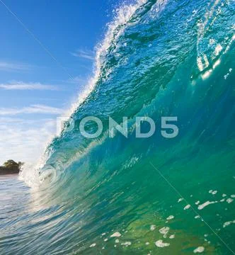Breaking ocean wave crashing over camera Stock Photos