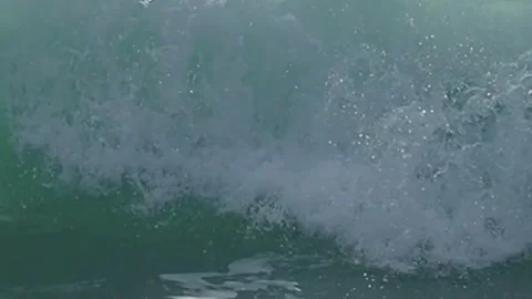 Breaking ocean wave forming a stunning turquoise colored swell Stock Footage 310248962