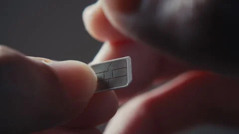 Breaking Old Mobile SIM Card by Hand for Data Privacy and Security Stock Footage 332165027