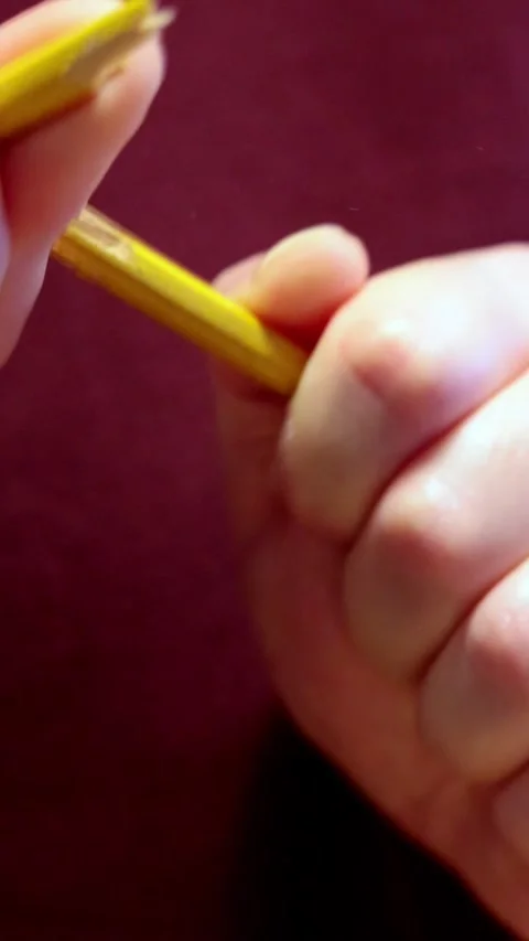 Breaking a pencil - vertical slow Stock Footage 326265352