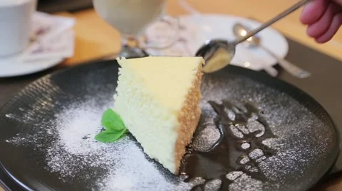 Breaking of a piece of cheesecake on a plate Stock Footage 61158221