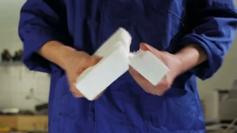 Breaking a piece of styrofoam Stock Footage 69166998