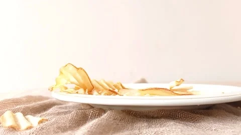 Breaking a potato chip with a hand Stock Footage 146251377