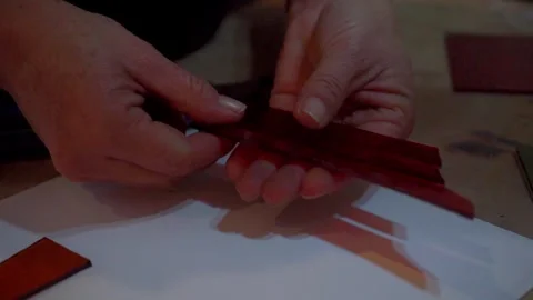 Breaking Red Glass to Create a Mosaic Stock Footage 293878991