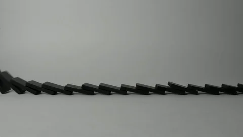 Breaking Row of Domino Stock Footage 74249624