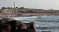 Breaking sea waves with lighthouse is on background, Mediterranean HD Footage