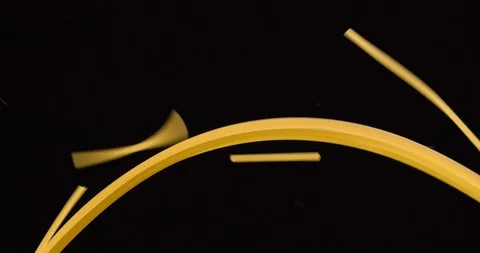 Breaking spaghetti on black background 4K video Stock Footage 104061910