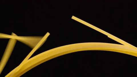 Breaking spaghetti on black background Closeup Slow motion Stock Footage 104063163
