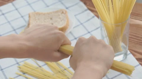 Breaking spaghetti, slow motion Stock Footage 68976629