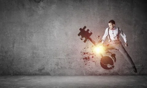 Breaking through access concept with furious man in room crashin Stock Photos