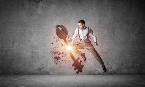 Breaking through access concept with furious man in room crashin 스톡 사진
