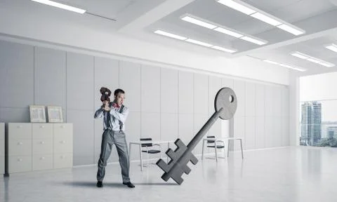 Breaking through access concept with furious man crashing concre 스톡 사진