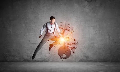 Breaking through access concept with furious man in room crashing concrete key 스톡 사진