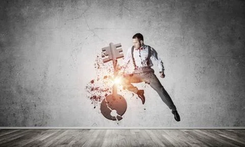 Breaking through access concept with furious man in room crashin Stock Photos