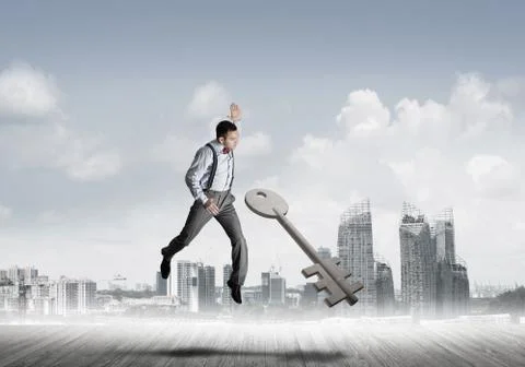 Breaking through access concept with furious man crashing concrete key Stock Photos