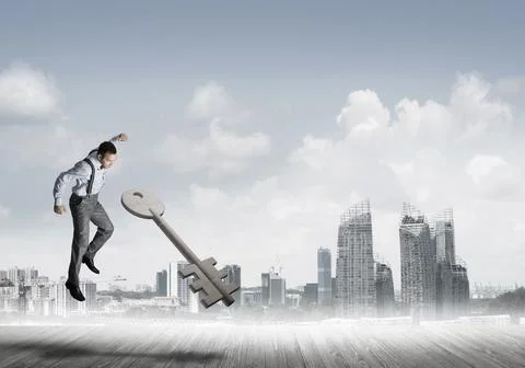 Breaking through access concept with furious man crashing concrete key Stock Photos