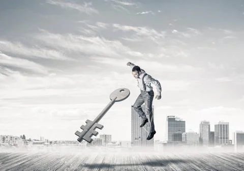 Breaking through access concept with furious man crashing concrete key Det... 스톡 사진