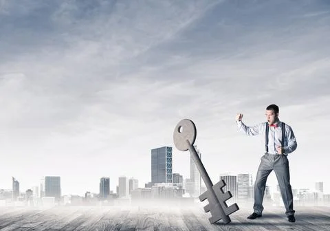 Breaking through access concept with furious man crashing concrete key Det... 스톡 사진