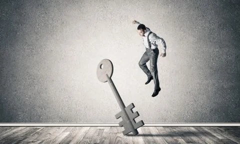 Breaking through access concept with man in room crashing concre Stock Photos