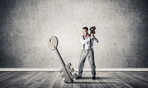 Breaking through access concept with man in room crashing concre 스톡 사진