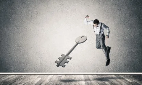 Breaking through access concept with man in room crashing concre Stock Photos