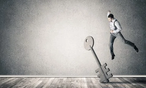 Breaking through access concept with man in room crashing concre Stock Photos