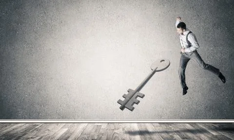 Breaking through access concept with man in room crashing concre Stock Photos