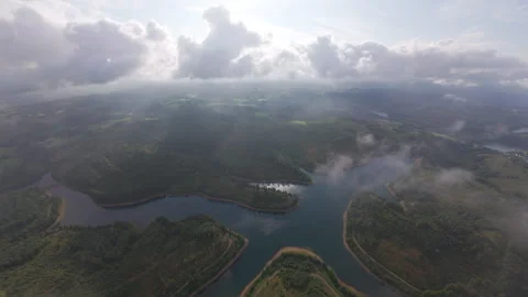 Breaking Through Clouds to Reveal a Scenic Lake 動画素材 313991816