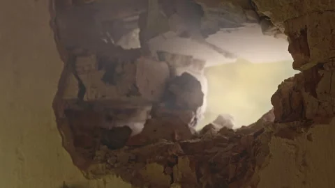 Breaking Through a Wall This Can Be a Destructive Process of Demolition and Stock Footage 314569049