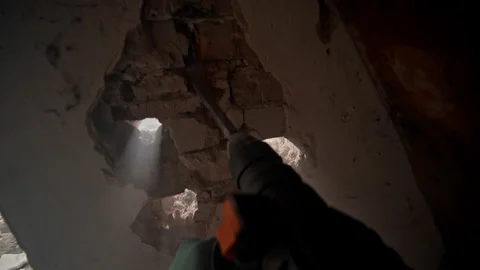 Breaking Through Walls with Power Tools in the Implementation of Construction 動画素材 313844412