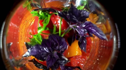 Breaking tomatoes and herbs in a blender. Obtaining tomato pulp . The stage o Stock Footage 158767199