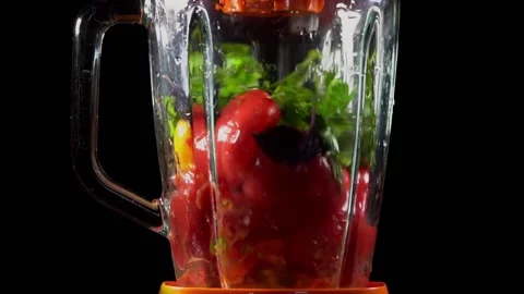 Breaking tomatoes and herbs in a blender. Obtaining tomato pulp . The stage o Stock Footage 158767207